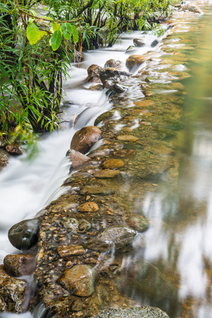 Beautiful water flowing at natural park, Thailandの写真素材
