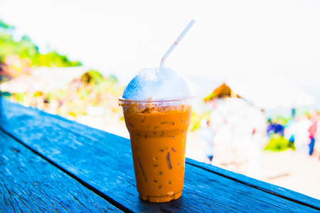 Iced Milk Tea on Wooden Table, Thailand.の写真素材