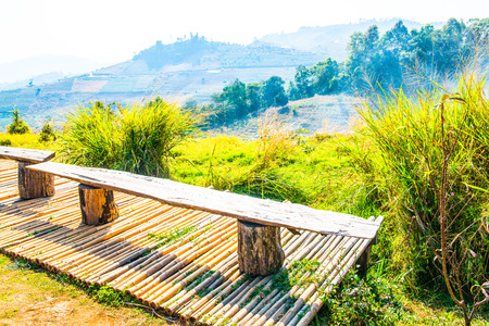 Wooden chairs on mountain, Thailand.の写真素材