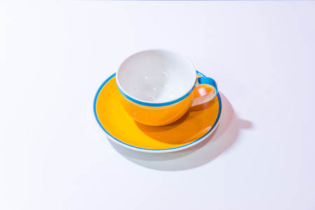 Yellow coffee cup with white background, Thailand.