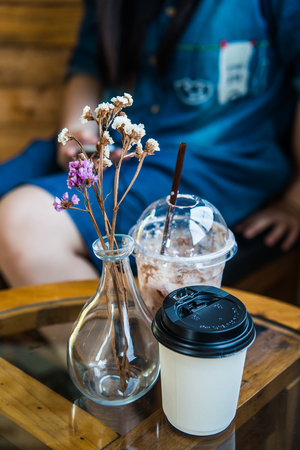 Iced Cocoa in Plastic Glass and Hot Coffee in Paper Cup, Thailand.の写真素材