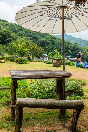 Set of picnic table with white umbrella, Thailand.の写真素材