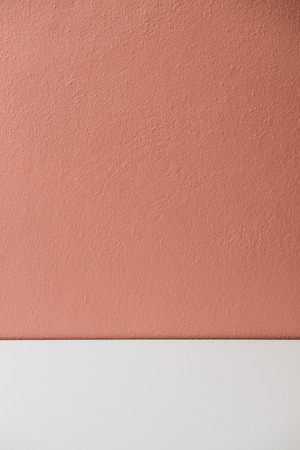 Orange plastering wall with white stripe, Thailand.の写真素材
