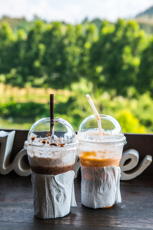 Iced Milk Tea and Iced Cocoa in Plastic Glass, Thailand.の写真素材