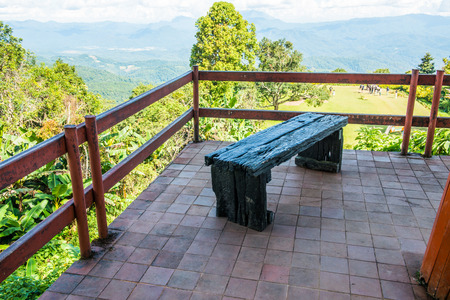 Wooden bench for view watching on mountain, Thailand.の写真素材