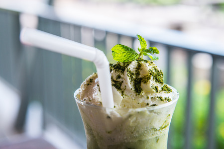 Iced green tea with whipped cream, Thailand.の写真素材