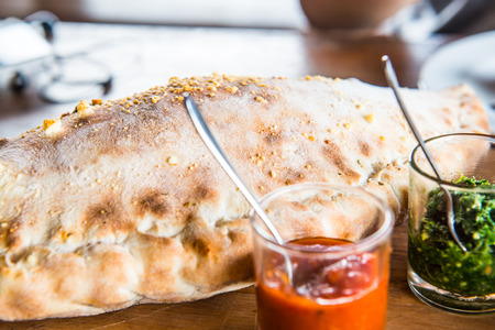 Pizza puff on wooden plate, Thailand.の写真素材
