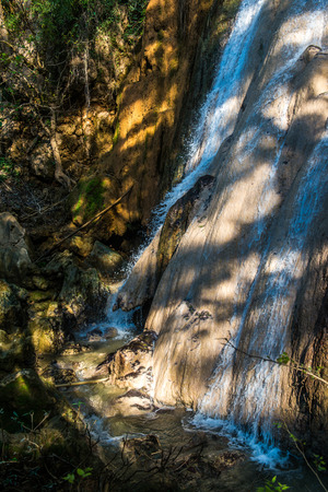Water flowing with tree shadow on stone, Thailand.の写真素材