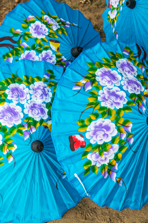 Thai native umbrella on ground, Thailand.の写真素材