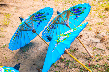 Thai native umbrella on ground, Thailand.の写真素材