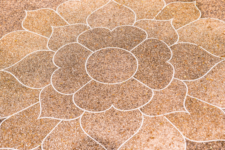 Thai style art on washed gravel floor, Thailand.の写真素材