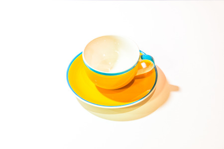 Yellow coffee cup with white background, Thailand.の写真素材