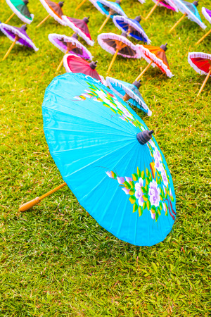 Thai native umbrella on ground, Thailand.の写真素材