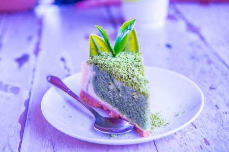 Green Tea Cheesecake on White Dish, Thailand.の写真素材