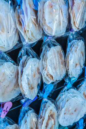 Grilled rice crisp in plastic bag, Thailand.の写真素材