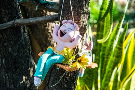 Lovely ceramic doll in park, Thailand.の写真素材