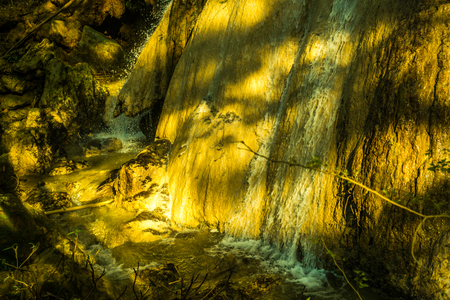 Water flowing with tree shadow on stone, Thailand.の写真素材