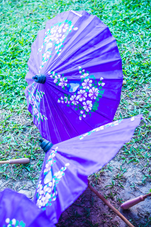 Thai native umbrella on ground, Thailand.の写真素材