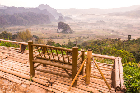 Bamboo Bench with Beautiful Mountain View at Phu Langka National Park, Thailand.の写真素材