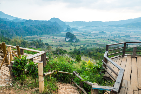 Wooden terrace with beautiful mountain view at Phu Langka national park, Thailand.の写真素材