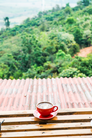 Hot coffee in red cup, Thailand.の写真素材