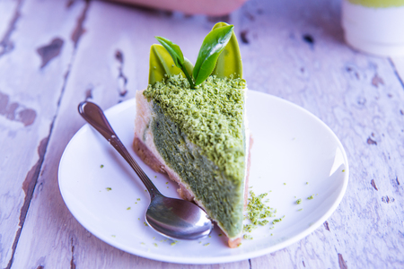 Green Tea Cheesecake on White Dish, Thailand.の写真素材