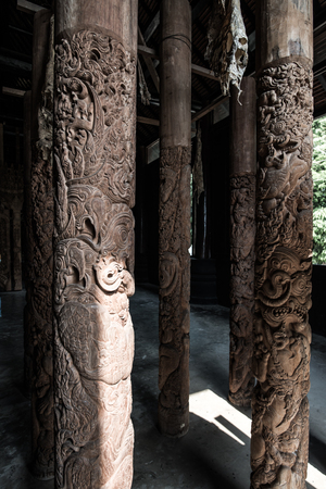 Carving art on wooden column, Thailand.の写真素材