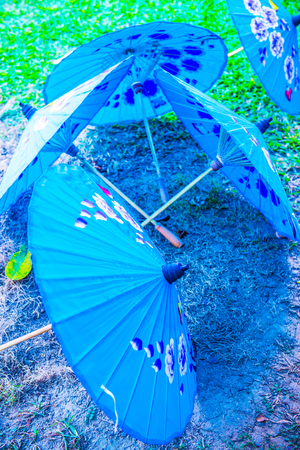 Thai native umbrella on ground, Thailand.の写真素材