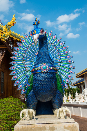 Peacock statue at Ban Den temple, Thailand.の写真素材