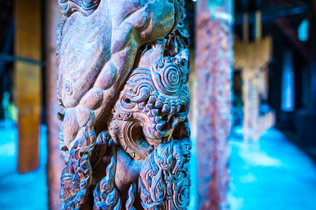 Carving art on wooden column, Thailand.の写真素材