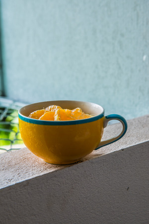 Orange Cheese Cake in Yellow Cup, Thailand.の写真素材