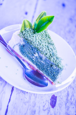 Green Tea Cheesecake on White Dish, Thailand.の写真素材