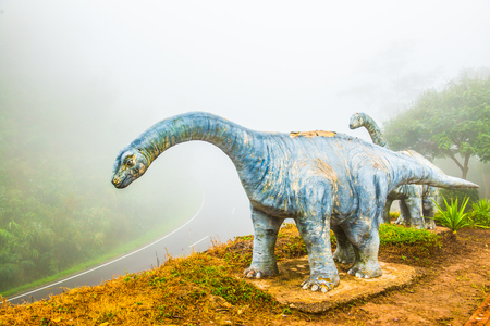 Model of Chiang Muang dinosaur with mist at Phayao province, Thailand.の写真素材