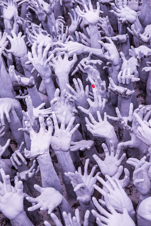 Hands molding art at Rong Khun temple, Thailand.の写真素材