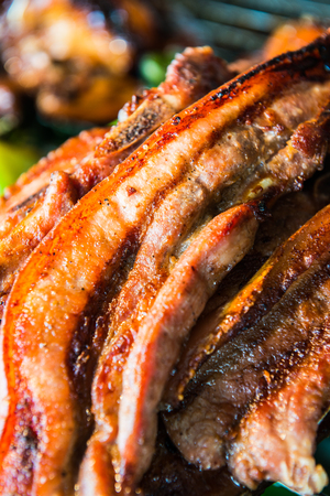 Charcoal boiled pork neck on grill, Thailand.の写真素材