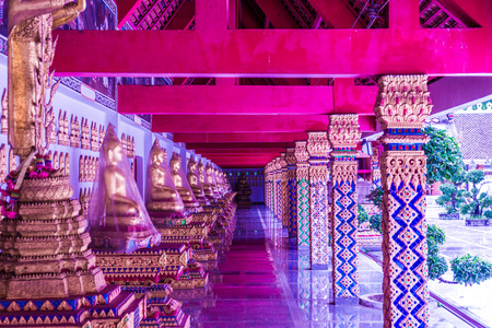Corridor with buddha statue around pagoda at Phra That Suthon Mongkhon Khiri temple, Thailand.のeditorial素材
