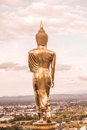 Walking buddha statue at Phra That Khao Noi temple, Thailand.の写真素材