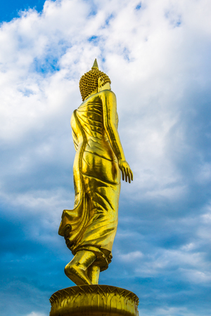 Walking buddha statue at Phra That Khao Noi temple, Thailand.の写真素材