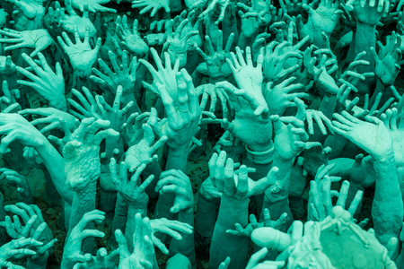 Hands molding art at Rong Khun temple, Thailand.の写真素材