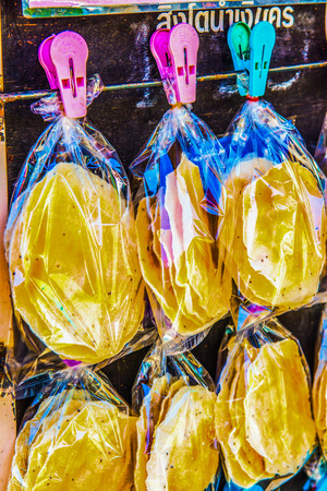 Grilled rice crisp in plastic bag, Thailand.の写真素材