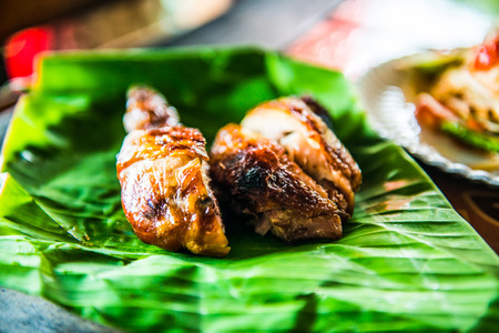 Grilled chicken on banana leaf, Thailand.の写真素材