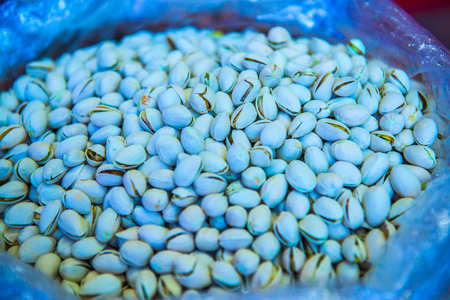 Pistachios nuts in plastic bag, Thailand.の写真素材
