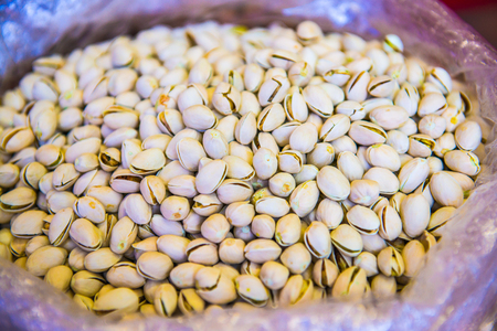 Pistachios nuts in plastic bag, Thailand.の写真素材
