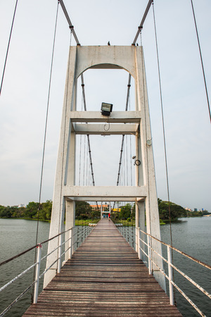 Suspension bridge in Nong Somboon lake, Thailand.の写真素材