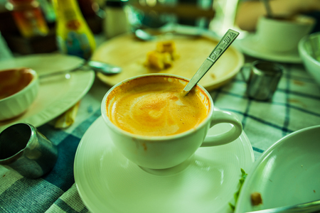Beautiful hot milk tea in a white cup, Thailand.の写真素材