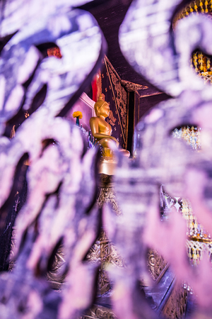Golden Buddha with Wooden Foreground, Thailand.の写真素材