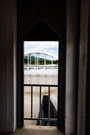 White bridge above Mae Tha river in the frame, Thailand.の写真素材