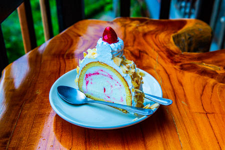 Almond ice cream cake on white plate, Thailand.の写真素材