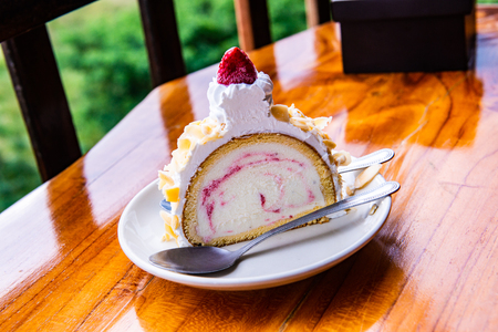 Almond ice cream cake on white plate, Thailand.の写真素材