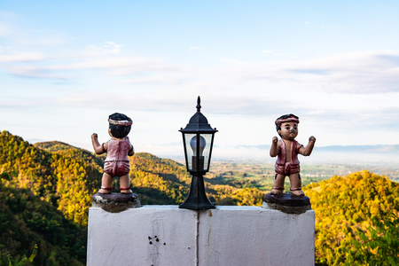 Lamp with Thai boxer statue at Phrathat Doi Leng temple, Thailand.の写真素材